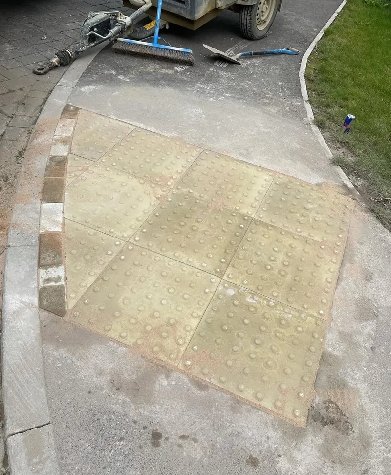 Tactile paving laid at a dropped kerb